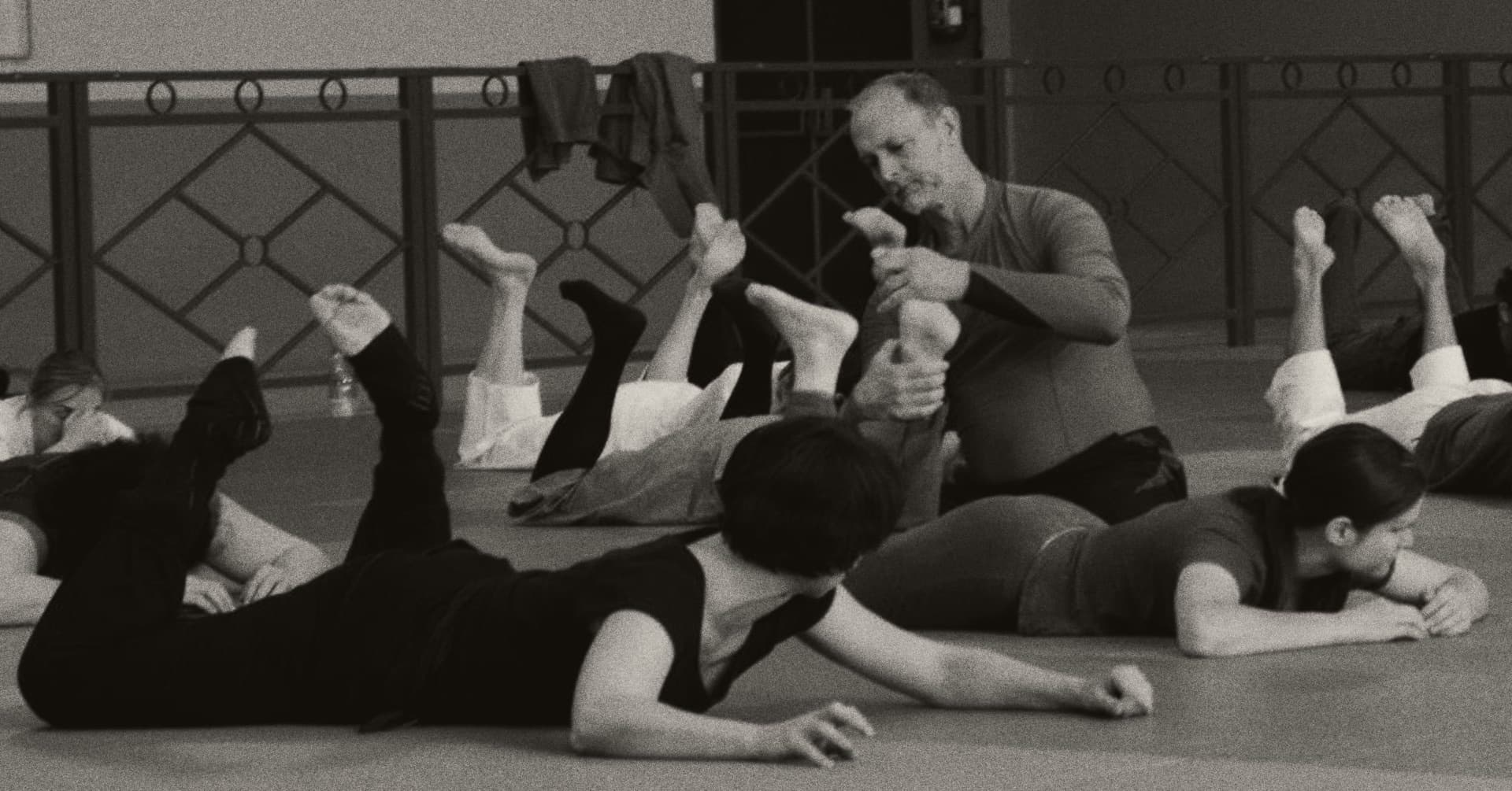 Allen Pittman teaching a group class, students crawling